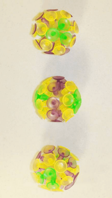 Three colorful suction balls